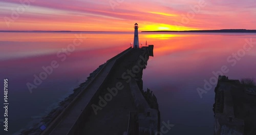 Wawatam Lighthouse in the stunning light of dawn, Saint Ignace, Upper Michigan. Aerial flyby. photo