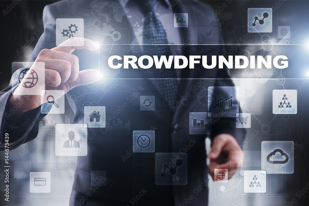 Businessman selecting crowdfunding on virtual screen. Businessman selecting crowdfunding on virtual screen.