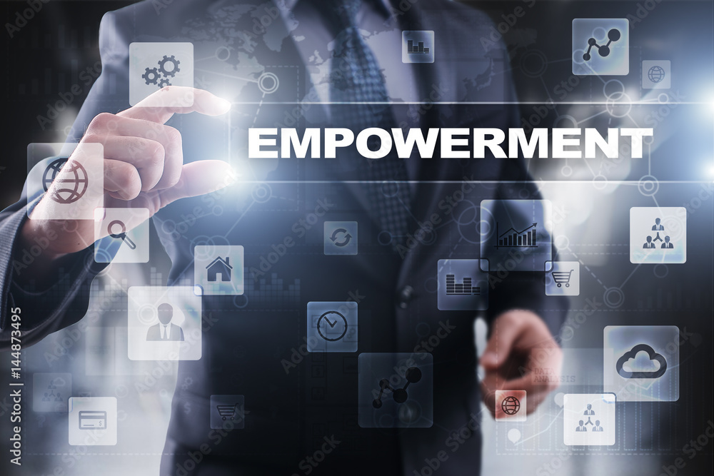 Businessman selecting empowerment on virtual screen. Businessman selecting empowerment on virtual screen.