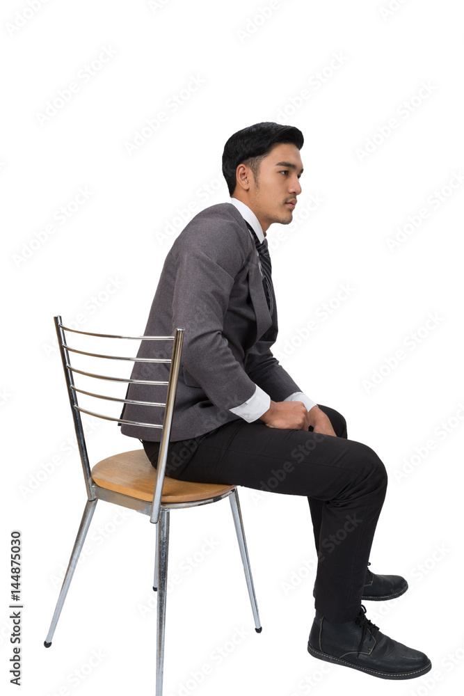 Businessman wearing gray suit sitting on chair and thinking over white Background Businessman wearing gray suit sitting on chair and thinking over white Background
