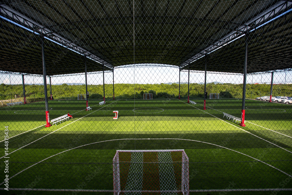 Obraz premium Football field Small, Futsal ball field in the gym indoor, Soccer sport field outdoor park with artificial turf