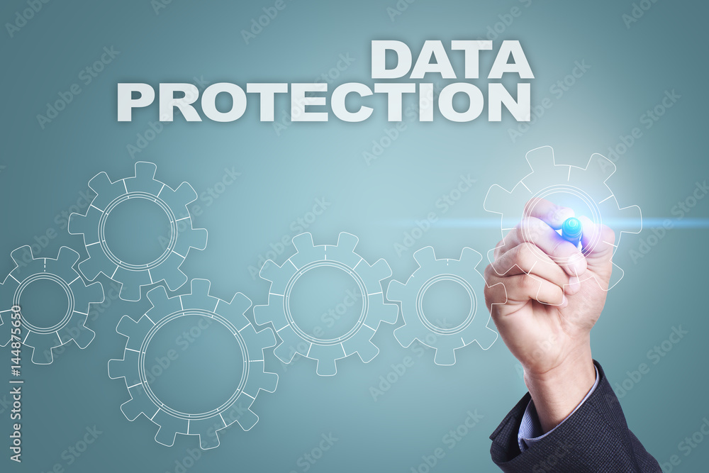 Businessman drawing on virtual screen. data protection concept Businessman drawing on virtual screen. data protection concept