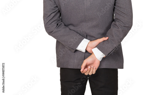 businessman holding wrist at the back showing body language