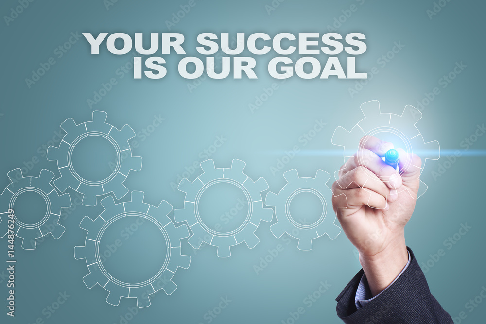 Businessman drawing on virtual screen. your success is our goal concept Businessman drawing on virtual screen. your success is our goal concept