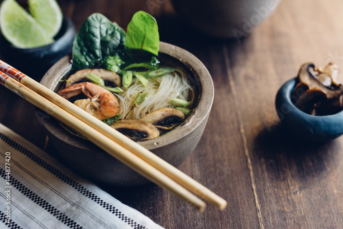  Bowl of Asian Noodle Soup with chopsticks photo