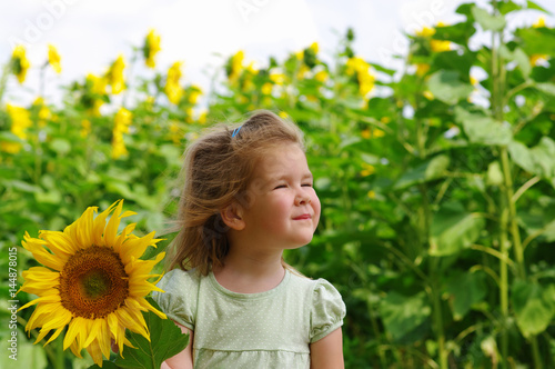  girl and sunflower on the field