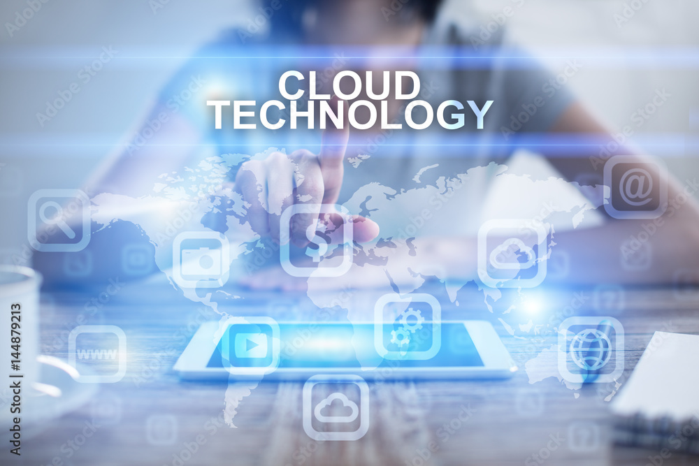 Woman using tablet pc, pressing on virtual screen and selecting cloud technology Woman using tablet pc, pressing on virtual screen and selecting cloud technology
