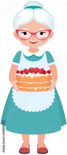 Elderly housewife grandmother wearing glasses and apron holding a homemade cake