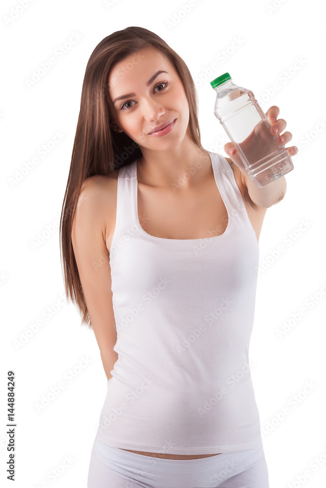 Beautiful healthy young girl drinking a bottle of pure clean water. Pretty woman holding a bottle of water in her hands on isolated background. Beautiful healthy young girl drinking a bottle of pure clean water. Pretty woman holding a bottle of water in her hands on isolated background.