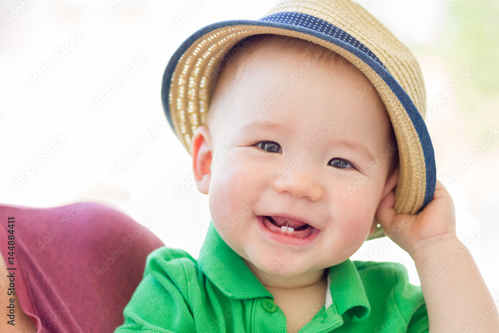 Portrait of A Happy Mixed Race Chinese and Caucasian Baby Boy Wearing His Hat Portrait of A Happy Mixed Race Chinese and Caucasian Baby Boy Wearing His Hat