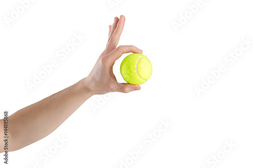 close-up of male hand holding tennis ball on white background © producer