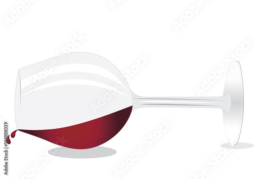 Overturned glass of red wine