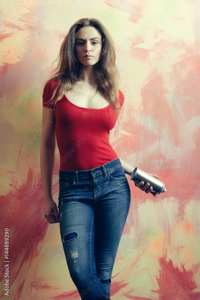 Fototapeta premium Pretty girl or beautiful painter with spray paint bottle