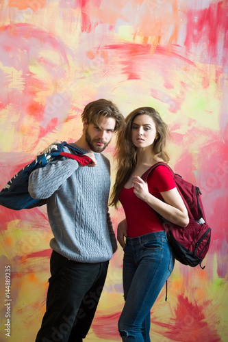 Pretty girl with backpack and bearded man with bag © Volodymyr