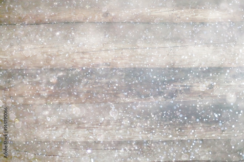 blurred wooden background with snow winter
