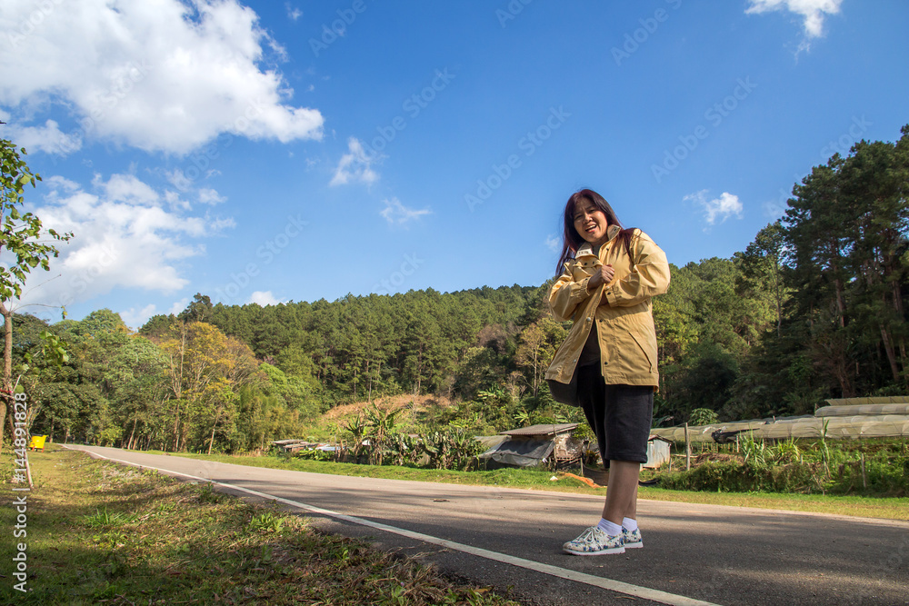 Happy woman traveler enjoy in holiday and castle on vacation while spring in Chiang mai,Thailand Happy woman traveler enjoy in holiday and castle on vacation while spring in Chiang mai,Thailand