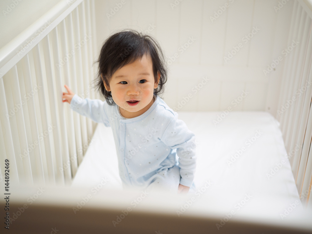 baby girl in cot baby girl in cot