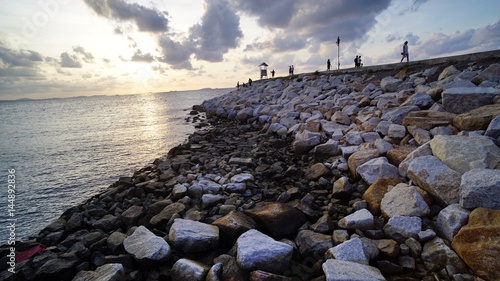 walkway bridge along the beach,Beach, rocky beach, beautiful beach, wooden bridges, wooden bridges along the beach, Koh Kham, Kham island, Sattahip, Chonburi, Thailand. © FotoArtist