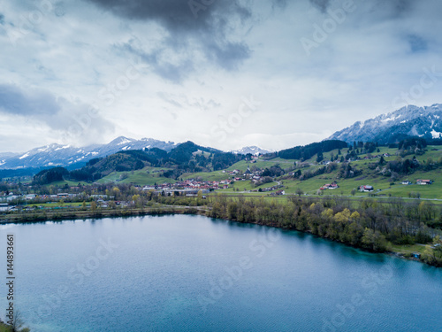Aerial view on lake with dramatic clouds