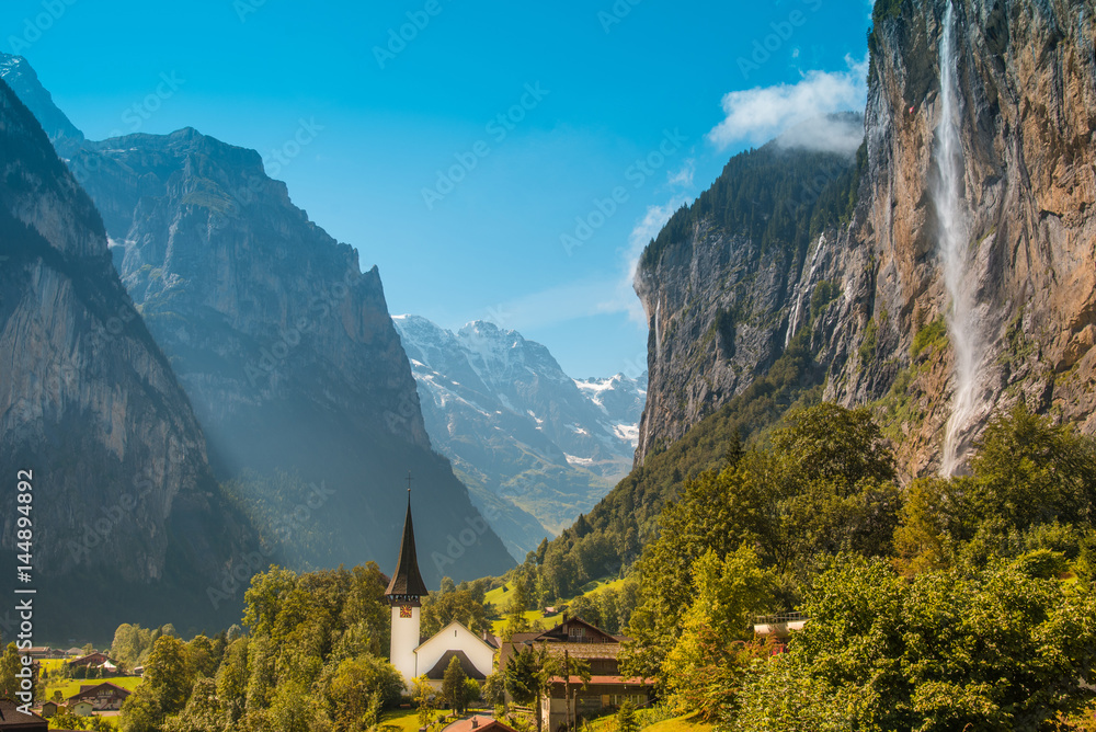 The unbelievable  landscape with waterfall and canyon church in Lauterbrunnen in the Swiss Alps, Switzerland, Europe