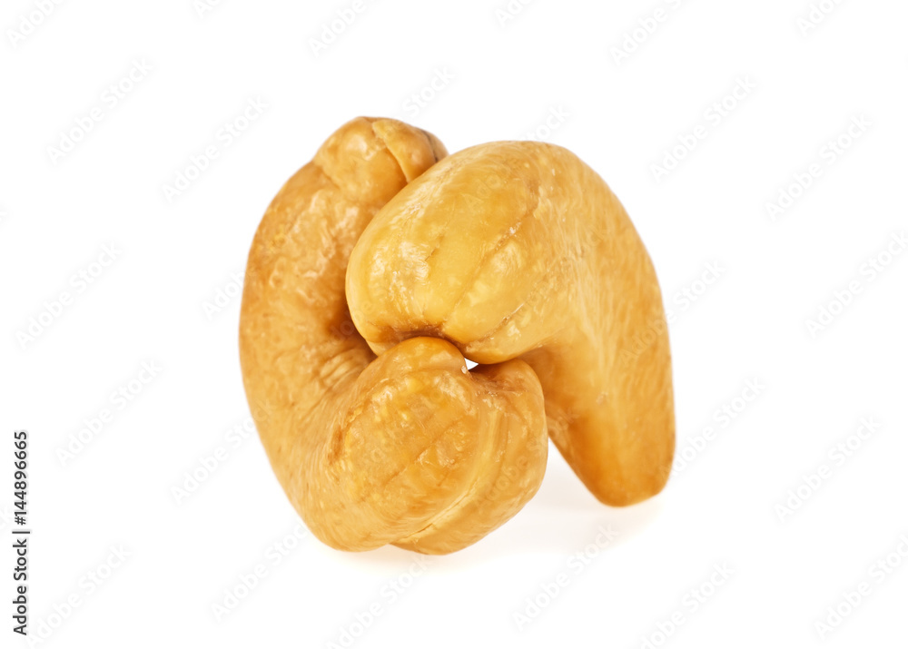 Roasted cashew nuts isolated on a white background, close up