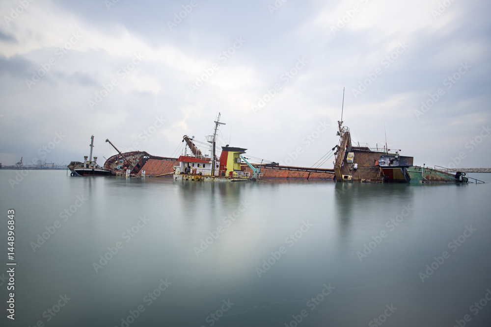 Sinking ship. Industrial sea port of Mersin. Turkey