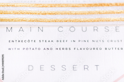 Wedding menu with gold ribbon