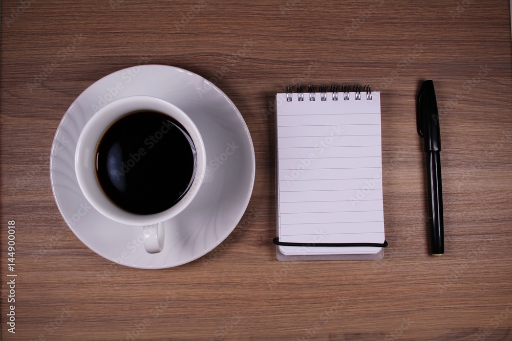 Blank notepad with pen and coffee Blank notepad with pen and coffee