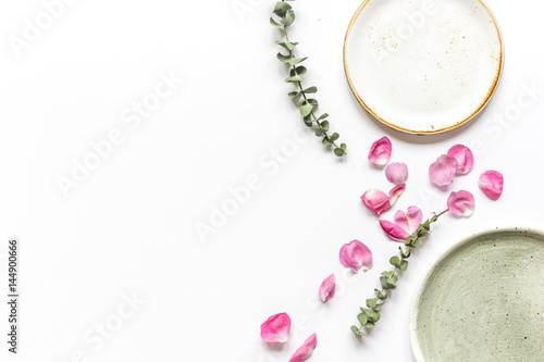 Spring trendy disign with flowers on white table background top view mock up