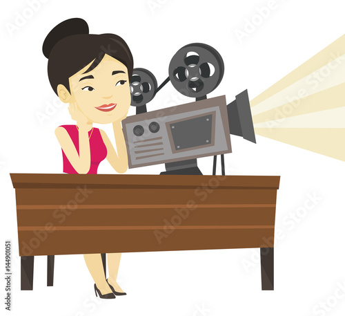 Asian projectionist showing new film.