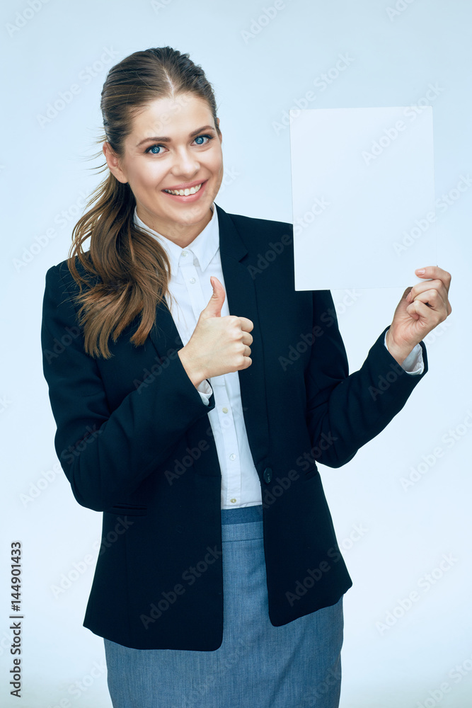 Smiling business woman in suit holding white blank sign board. Smiling business woman in suit holding white blank sign board.