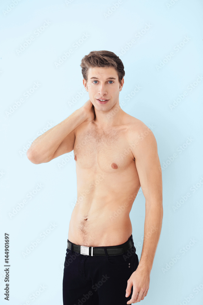 Handsome young man on light background