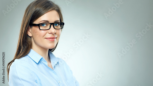 Business woman with long hair wearing glasses.