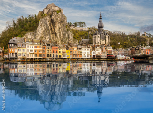 Beautiful City of Dinant reflected in the river Maas. Historical village in Belgium