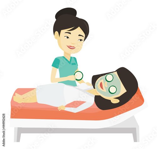 Cosmetologist making beauty treatments to woman.