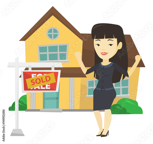 Real estate agent with sold placard.