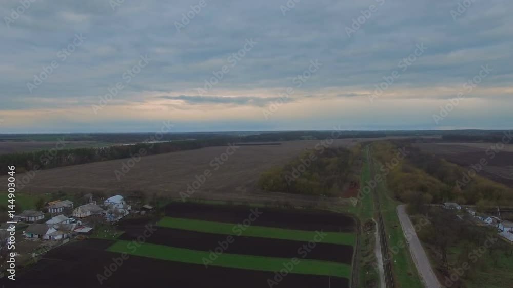Just sown field. Spring and elite fertile black soil in the village Just sown field. Spring and elite fertile black soil in the village