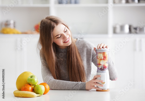 Young woman preparing fresh...