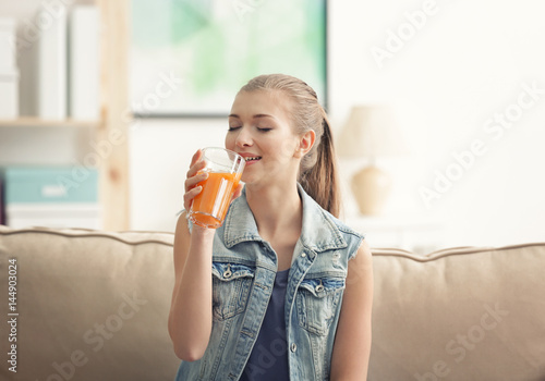 Young woman tasting fresh j...
