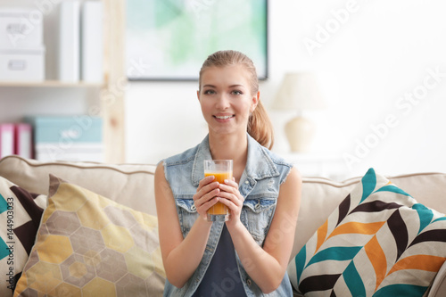 Young woman tasting fresh j...