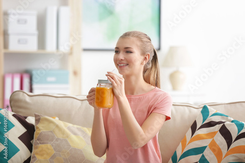 Young woman tasting fresh j...