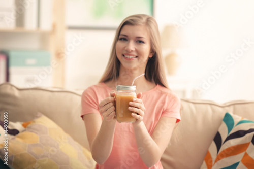 Young woman tasting fresh j...