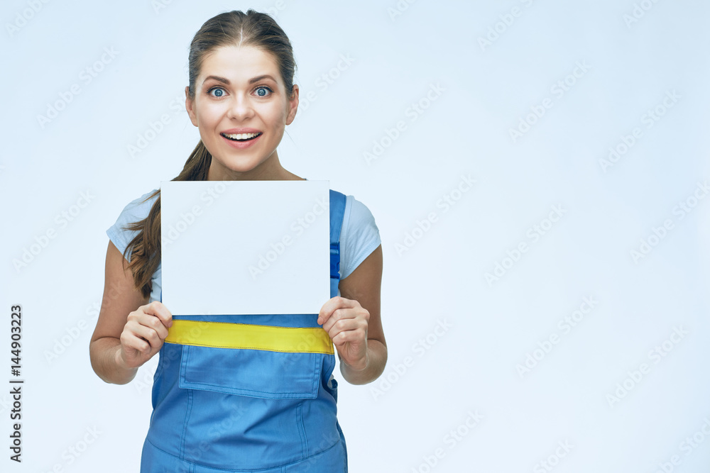 smiling woman worker wearing coverall holding advertising banner. smiling woman worker wearing coverall holding advertising banner.
