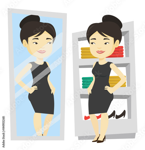 Woman trying on clothes in dressing room.