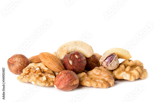 Heap from various kinds of nuts almond, walnut, hazelnut, cashew, Brazil nut isolated on white