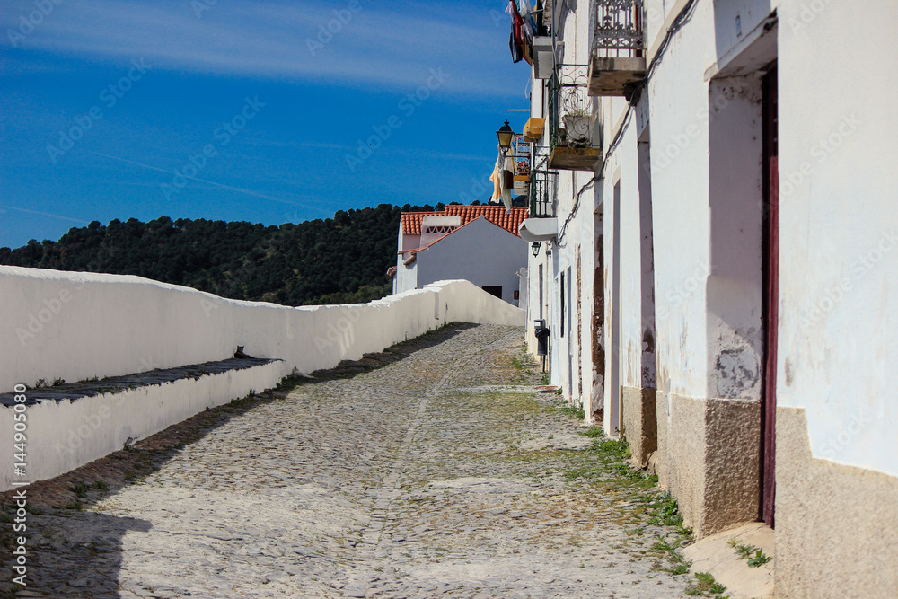 Typical street in the ancient village of Mertola. Alentejo Region. Portugal