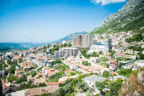 Obraz na płótnie 2016, Albania, Kruja. Beautiful view to the city and moutains. Blue sky and green landscape with red roofs of the city w salonie