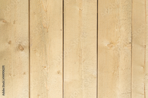 Raw wooden vertical panel plank wall