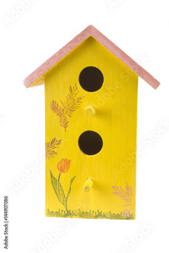 Homemade Yellow Birdhouse with a Pink Colored Roof
