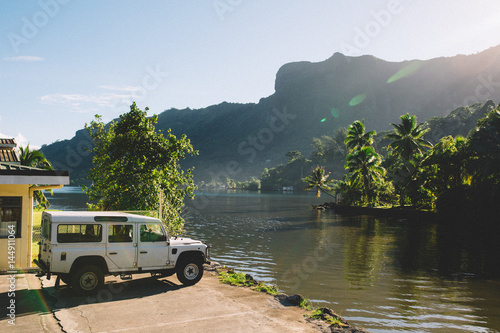 Four wheel drive by riverside and mountains, Mo'orea, South Pacific 